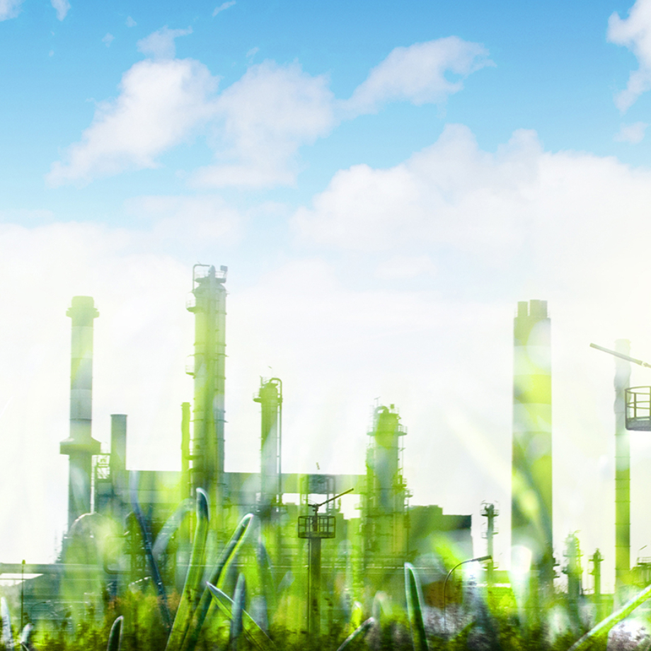 Green industrial development concept with grass of factory. Eco power production